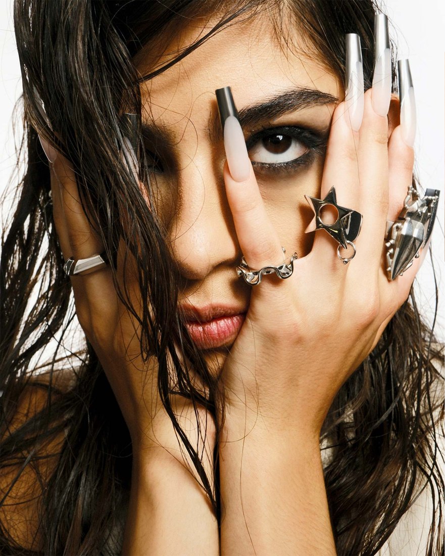 Chrome nails and silver rings